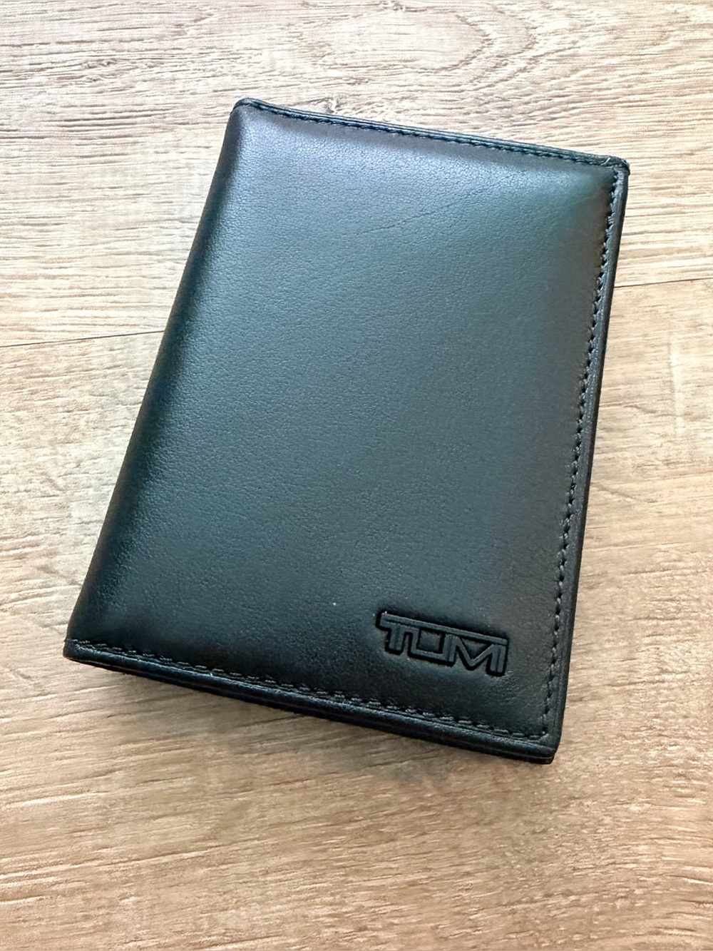 TUMI black L-fold wallet